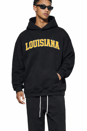 Louisiana State Pride Hoodie in Black / Gold — lifestyle 1
