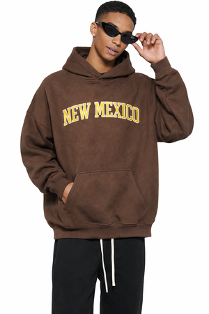 New Mexico State Pride Hoodie in Brown / Gold — lifestyle 1