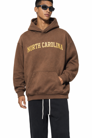 North Carolina State Pride Hoodie in Brown / Cream — lifestyle 1