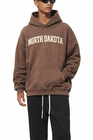 North Dakota State Pride Hoodie in Brown / Cream — lifestyle 1