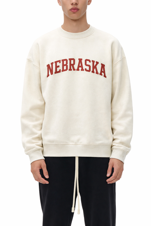 Nebraska Crewneck Sweatshirt in Cream / Dull Red — lifestyle 1