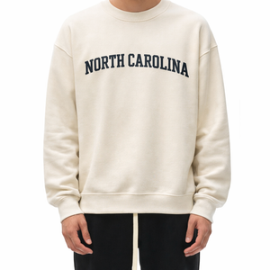 North Carolina Crewneck Sweatshirt in Cream / Navy — lifestyle 1